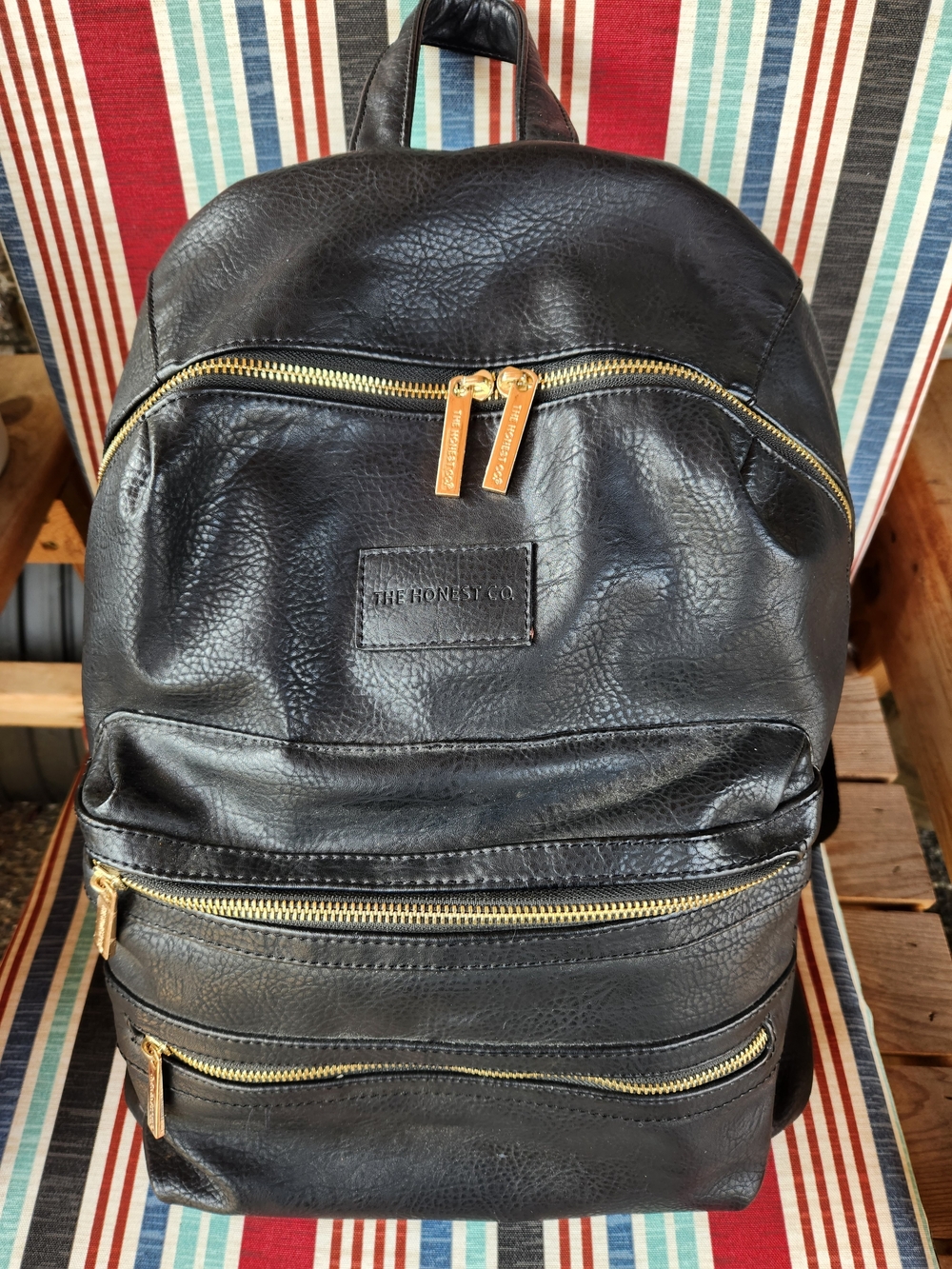 The Honest Company Black Faux Leather Baby Backpack with Gold Hardware